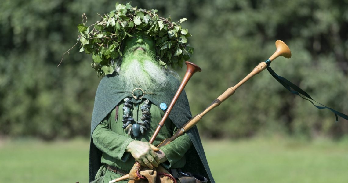 Man dressed in green with bagpipes-credit Sue Freeman